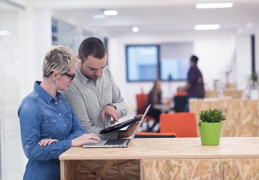 Business team having meeting in modern bright office interior brainstorming